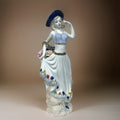 Figurine of Alice with Big Flower Basket
